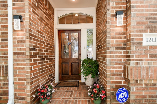 entrance to property with brick siding