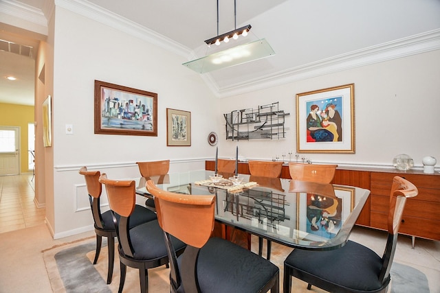 dining space featuring ornamental molding, indoor wet bar, visible vents, and light tile patterned floors