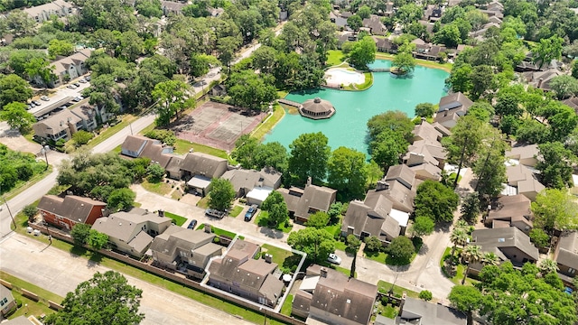 drone / aerial view featuring a water view and a residential view