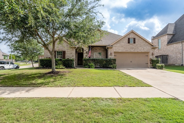 view of front of property featuring concrete driveway, brick siding, a front lawn, and a garage