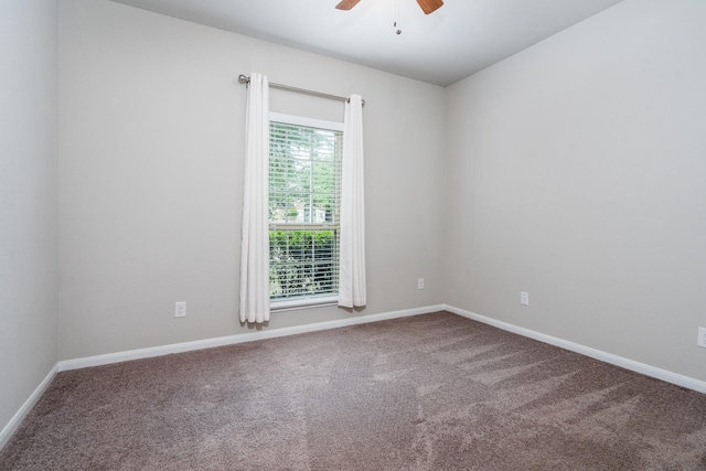 spare room featuring baseboards, a ceiling fan, and carpet flooring