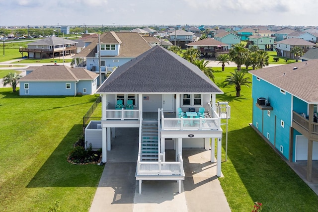 978 Sue Dr, Crystal Beach, TX 77650 - rear view of property featuring a carport, stairs, a residential view, a shingled roof, and a porch