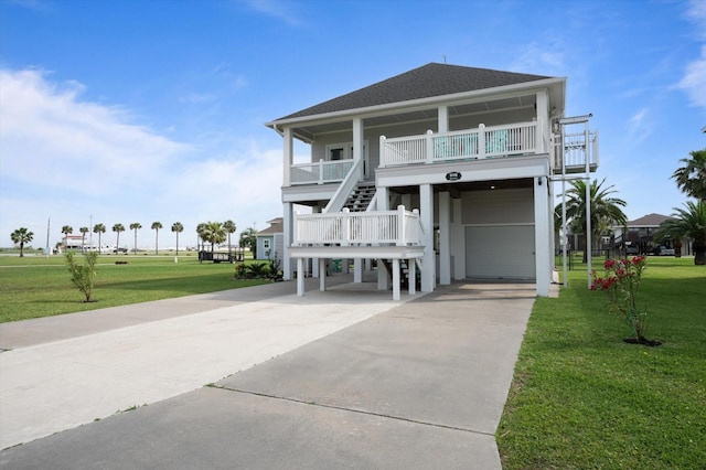 978 Sue Dr, Crystal Beach, TX 77650 - beach home featuring concrete driveway, a carport, a front lawn, and stairs