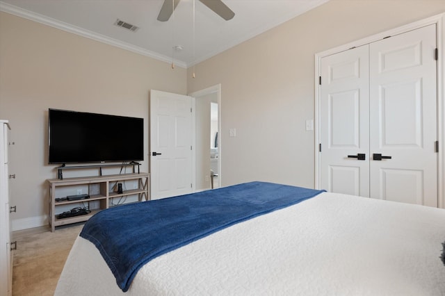 978 Sue Dr, Crystal Beach, TX 77650 - bedroom with light colored carpet, visible vents, crown molding, and a closet
