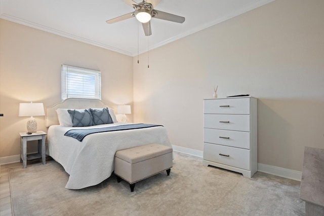 978 Sue Dr, Crystal Beach, TX 77650 - bedroom with ornamental molding, ceiling fan, light carpet, and baseboards