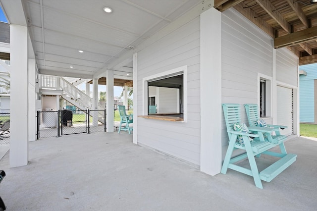 978 Sue Dr, Crystal Beach, TX 77650 - view of patio with a gate, fence, and stairs