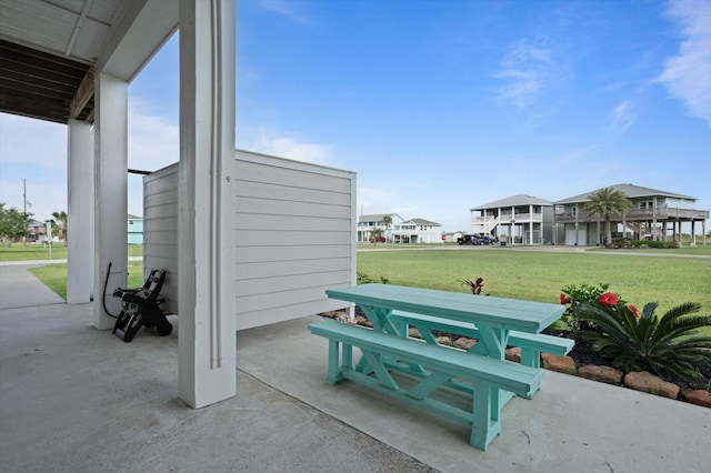 978 Sue Dr, Crystal Beach, TX 77650 - view of home's community featuring a yard and a patio area