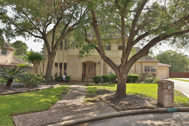 16615 Brendon Ct, Spring, TX 77379 - view of front facade featuring concrete driveway, a front lawn, and brick siding