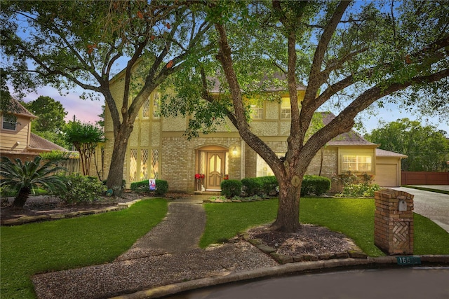 16615 Brendon Ct, Spring, TX 77379 - view of front of property featuring brick siding, an attached garage, a yard, and driveway