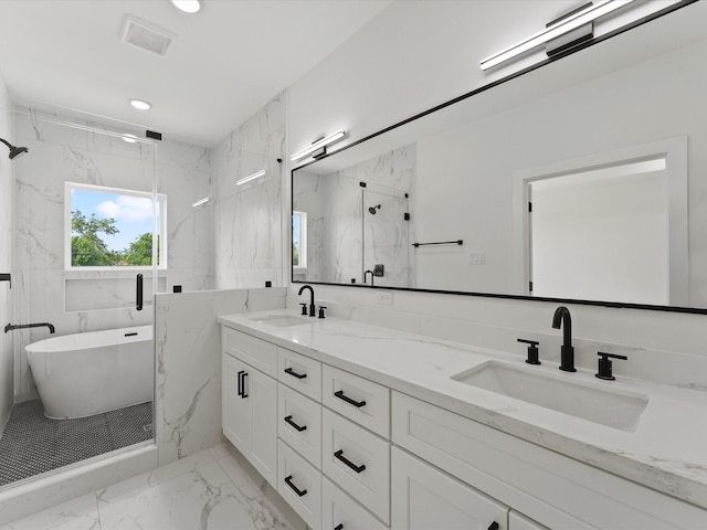 full bathroom with double vanity, a marble finish shower, marble finish floor, and a sink