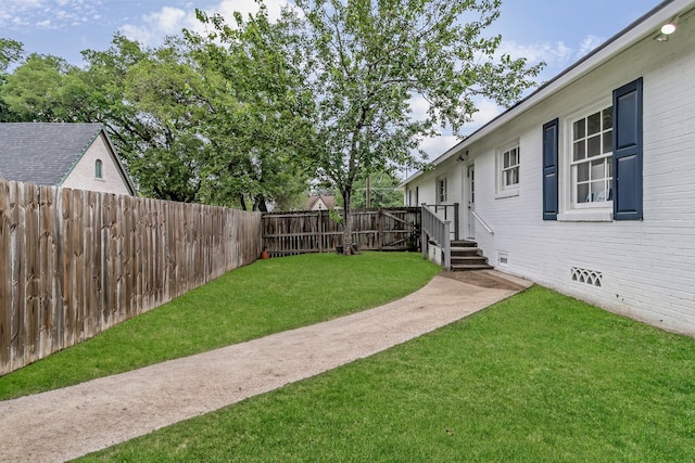 view of yard with a fenced backyard