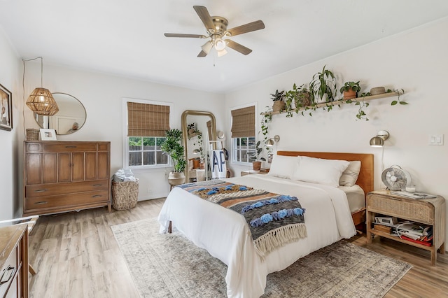 bedroom featuring wood finished floors and a ceiling fan
