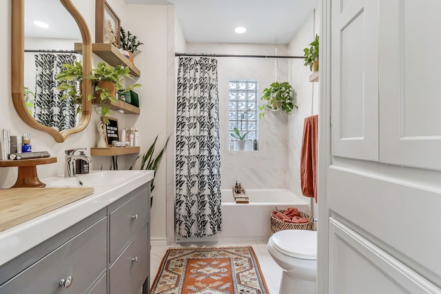 bathroom with shower / tub combo with curtain, toilet, tile patterned flooring, and vanity