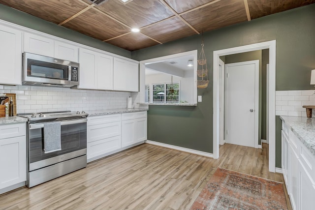 kitchen with tasteful backsplash, light wood-style flooring, wood ceiling, stainless steel appliances, and white cabinets