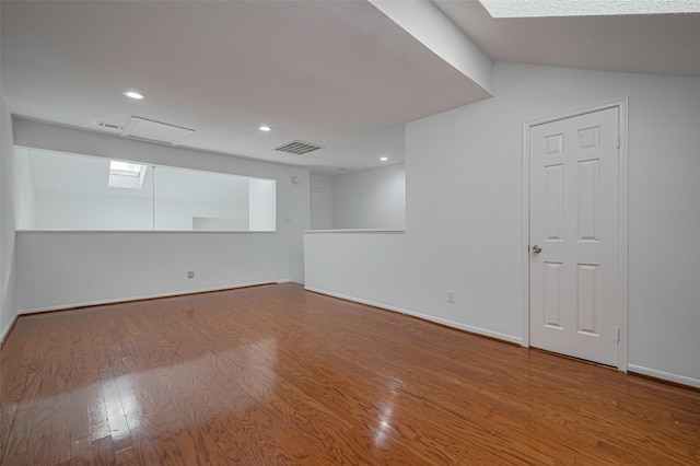 16800 Sugar Pines Dr Unit D28, Houston, TX 77090 - spare room with recessed lighting, visible vents, baseboards, a skylight, and wood finished floors