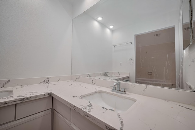 16800 Sugar Pines Dr Unit D28, Houston, TX 77090 - bathroom with visible vents, vanity, a washtub, and recessed lighting
