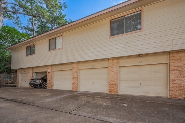 16800 Sugar Pines Dr Unit D28, Houston, TX 77090 - view of side of home with brick siding and an attached garage