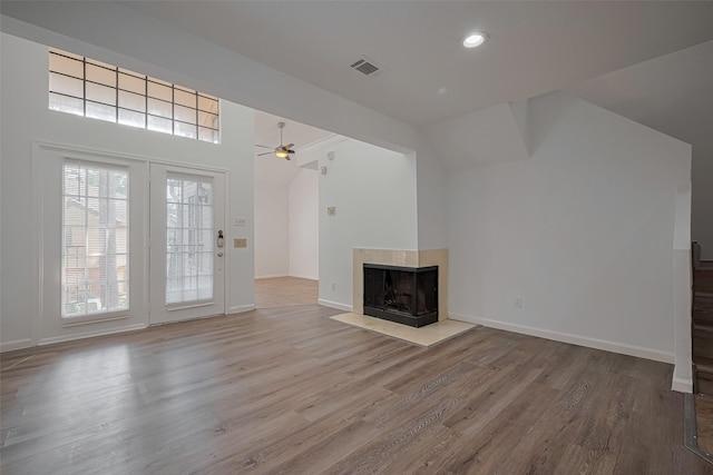 16800 Sugar Pines Dr Unit D28, Houston, TX 77090 - unfurnished living room featuring visible vents, wood finished floors, a wealth of natural light, and ceiling fan