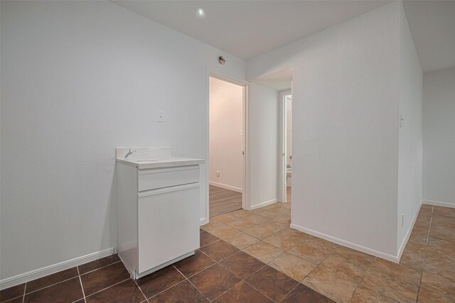 16800 Sugar Pines Dr Unit D28, Houston, TX 77090 - unfurnished room with baseboards and stone finish flooring
