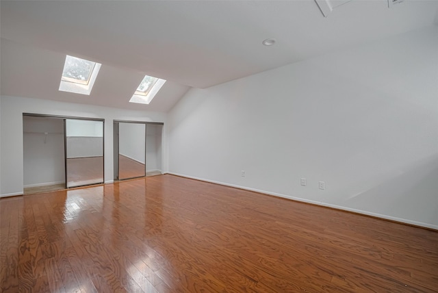 16800 Sugar Pines Dr Unit D28, Houston, TX 77090 - additional living space featuring wood finished floors, baseboards, and vaulted ceiling with skylight