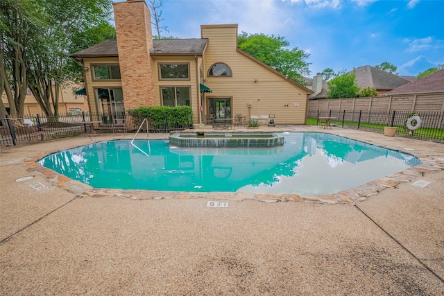 16800 Sugar Pines Dr Unit D28, Houston, TX 77090 - view of pool featuring fence, a patio, and a pool with connected hot tub