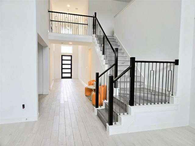 1902 Longcroft Ln, Katy, TX 77493 - entrance foyer with stairs, a high ceiling, baseboards, and wood finished floors