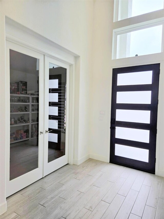 1902 Longcroft Ln, Katy, TX 77493 - foyer with light wood-style flooring, french doors, and baseboards