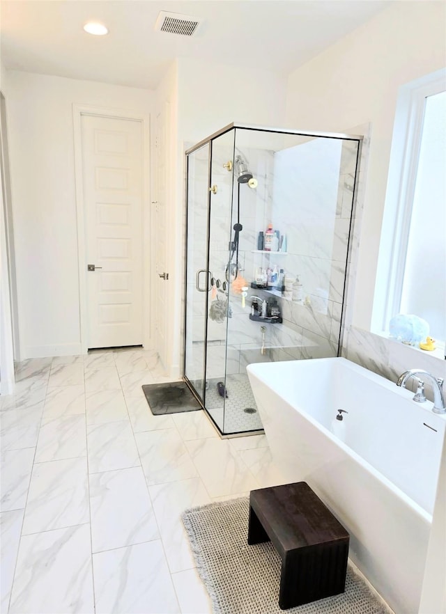 1902 Longcroft Ln, Katy, TX 77493 - full bath with a stall shower, a freestanding tub, recessed lighting, and marble look tile flooring