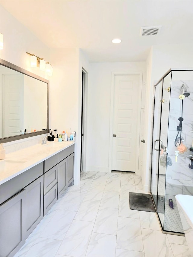 1902 Longcroft Ln, Katy, TX 77493 - bathroom with a stall shower, a soaking tub, double vanity, marble finish floors, and recessed lighting