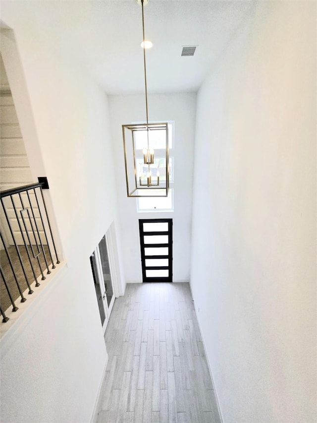 1902 Longcroft Ln, Katy, TX 77493 - foyer entrance with a chandelier, wood finished floors, stairs, and baseboards