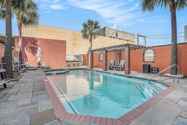 view of pool featuring a pergola, a pool with connected hot tub, central AC unit, and a patio area