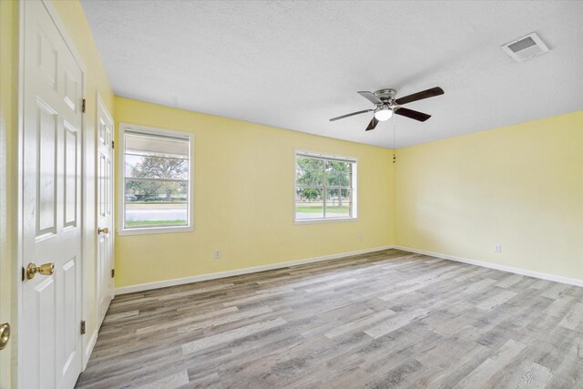 636 S Fm 356, Onalaska, TX 77360 - unfurnished room with baseboards, ceiling fan, wood finished floors, and visible vents