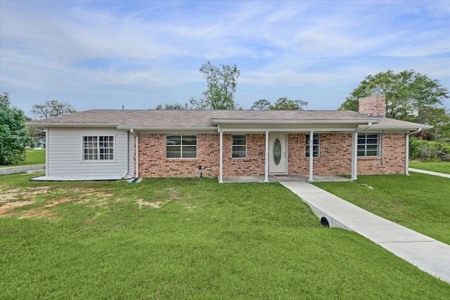 636 S Fm 356, Onalaska, TX 77360 - ranch-style home with brick siding, a chimney, and a front yard