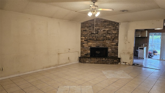 unfurnished living room featuring visible vents, light tile patterned floors, a ceiling fan, and lofted ceiling