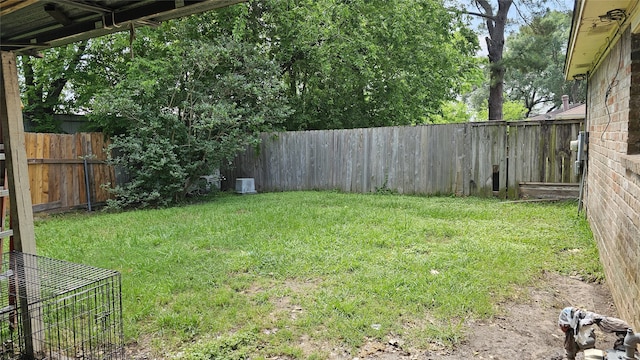view of yard with a fenced backyard