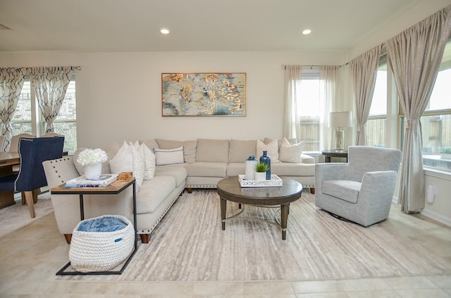 living area featuring a healthy amount of sunlight and recessed lighting