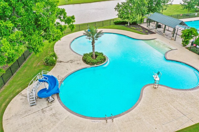 30219 Gold Finch Pl, Fulshear, TX 77441 - community pool featuring a water slide and a patio