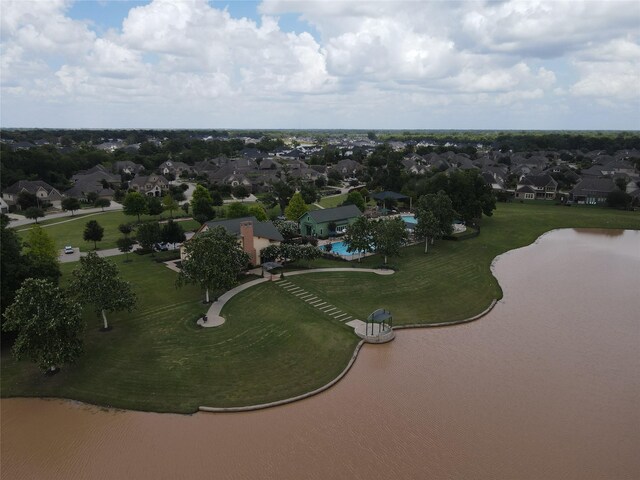 30219 Gold Finch Pl, Fulshear, TX 77441 - aerial overview of property's location featuring nearby suburban area and a large body of water