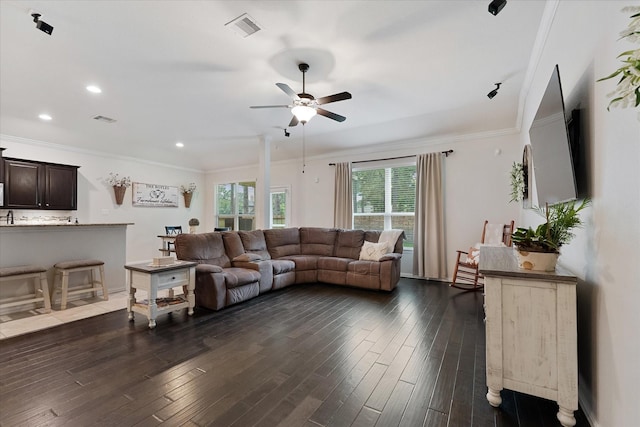 living area featuring a ceiling fan, dark wood finished floors, crown molding, and recessed lighting