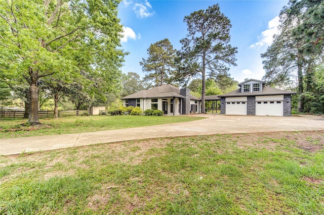 ranch-style home featuring a garage, fence, a front lawn, and concrete driveway