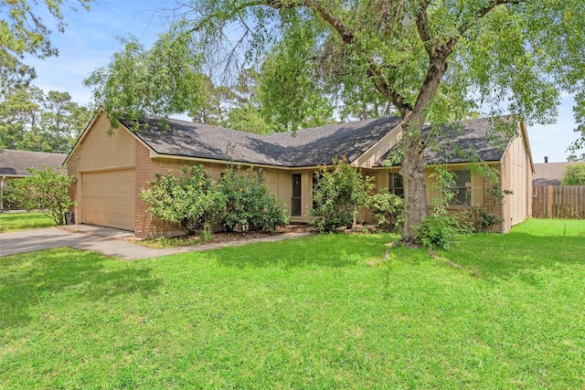 ranch-style house featuring brick siding, fence, a garage, a front lawn, and concrete driveway