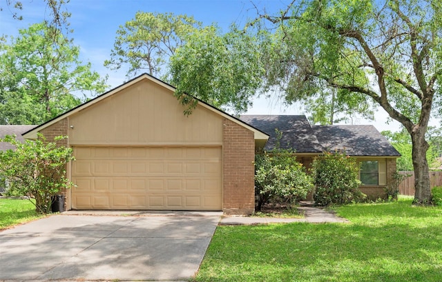 single story home featuring brick siding, a garage, roof with shingles, a front lawn, and concrete driveway