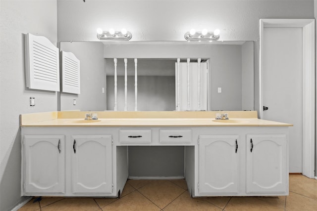 full bathroom with tile patterned floors, double vanity, and a sink
