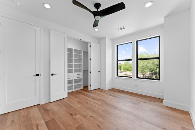 unfurnished bedroom featuring light wood-style floors, baseboards, recessed lighting, and visible vents