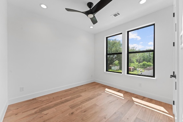 unfurnished room featuring recessed lighting, baseboards, and light wood-style floors