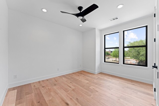 spare room with recessed lighting, ceiling fan, light wood finished floors, and visible vents