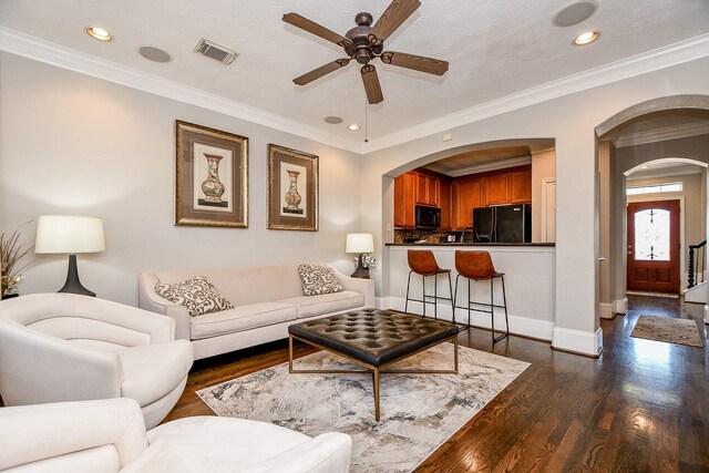 1708 Aden Mist Dr, Houston, TX 77003 - living room featuring arched walkways, ceiling fan, dark wood finished floors, recessed lighting, and baseboards