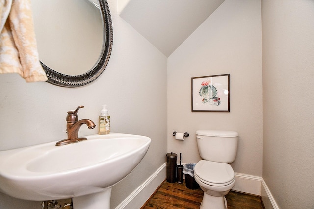 1708 Aden Mist Dr, Houston, TX 77003 - half bathroom featuring a sink, toilet, wood finished floors, baseboards, and vaulted ceiling