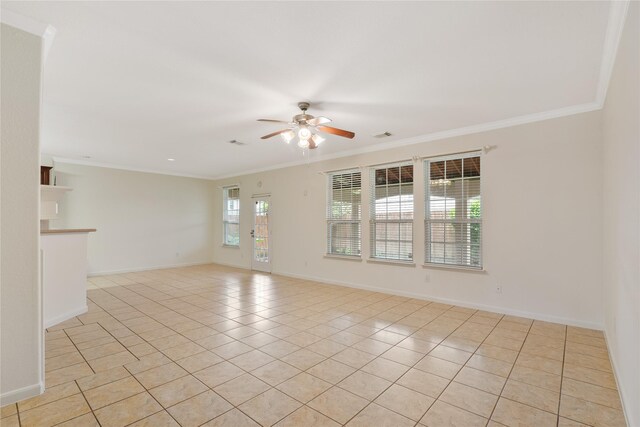 empty room with crown molding, a ceiling fan, light tile patterned floors, and baseboards