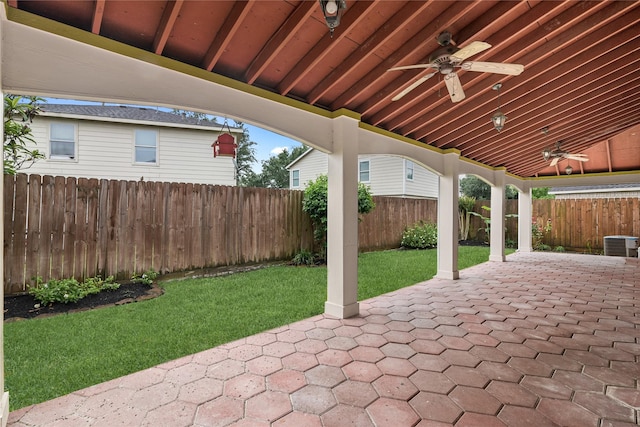 view of patio featuring cooling unit, ceiling fan, and a fenced backyard
